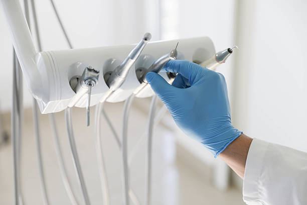 Professional Tooth Extraction technician working in Gwinnett County County, GA